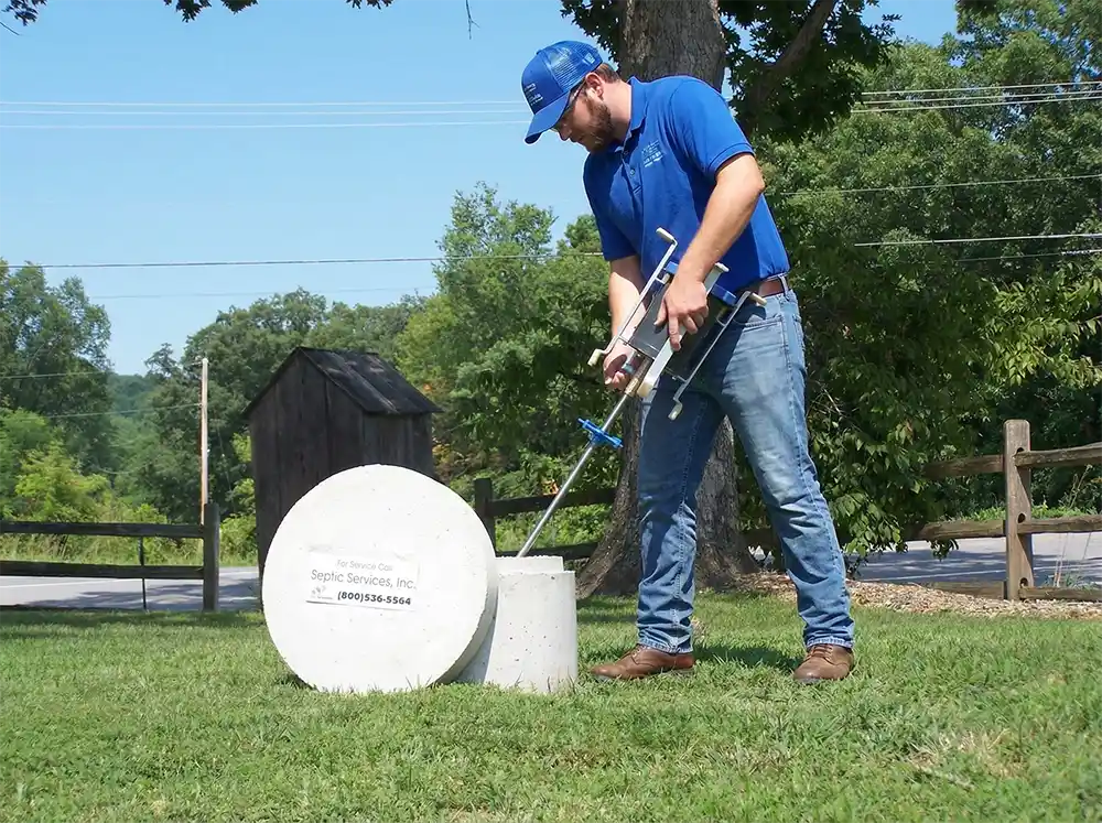 septic worker installing a new flagg air aerator